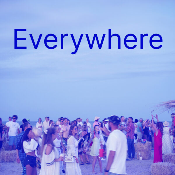 Text: Everywhere Image: People at an outdoor event